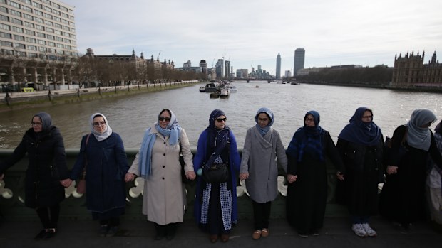 Dozens of women held hands on Westminster Bridge to remember victims of the London terror attack. (AFP)