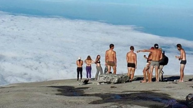 The group of foreign tourists strip down on Mount Kinabalu in Borneo. (Supplied)