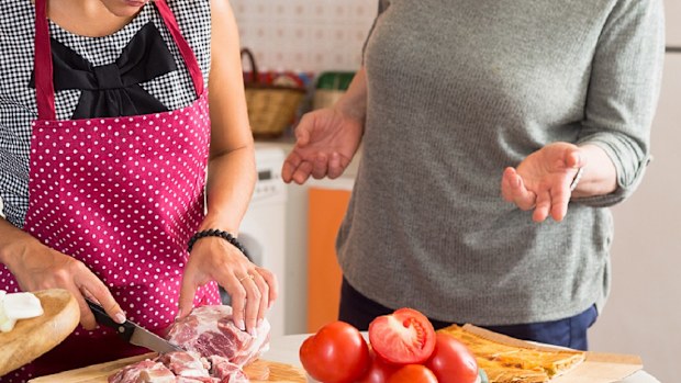 wife and mother in law cooking in kitchen before dinner