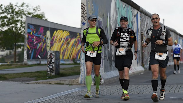 Runners taking part in the Berlin Wall ultramarathon. (Getty)