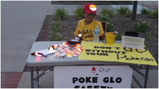 A young boy has created reflective 'Poke Glo' badges to keep his local community safe. (Twitter)