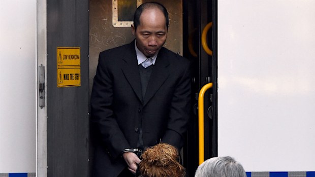 Lian Bin "Robert" Xie is escorted from a prison transport vehicle on his arrival at the NSW Supreme Court. (AAP)