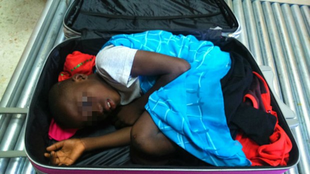 A picture provided by Spanish Guardia Civil shows an 8-year-old sub-Saharan boy hidden in a suitcase. (AFP)