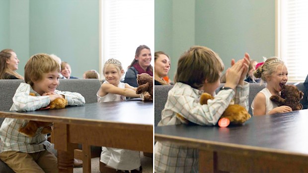 Two children grin after a judge announces their successful adoption by a foster family. (Facebook/Love What Matters/Heather Nelson)