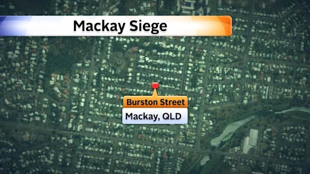 Police are involved in a standoff with a gunman in Burston Street, Mackay.