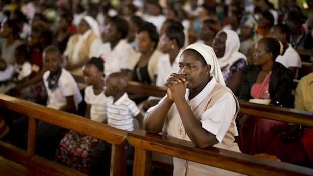 Mourners in Kenya grieve at an Easter Sunday service . (AAP)