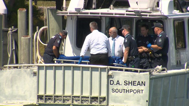Police don't suspect foul play after the body of a tattooed man washed up on South Stradbroke Island. (9NEWS)