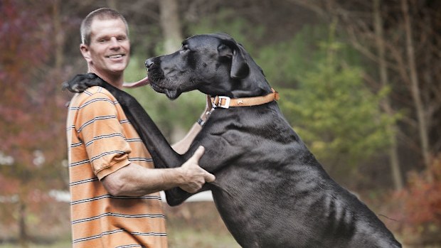 Kevin Doorlag stands with his dog Zeus. (Guinness World Records 2013)