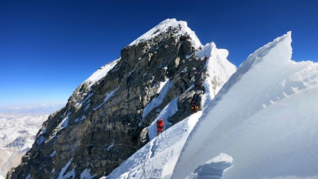 Climbers navigate the knife-edge ridge just below the Hillary Step on their way to the summit of Mount Everest. (AP Photo/Alpenglow Expeditions, Adrian Ballinger) 