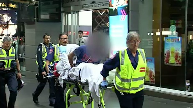 The man is taken to hospital by paramedics. (9NEWS)