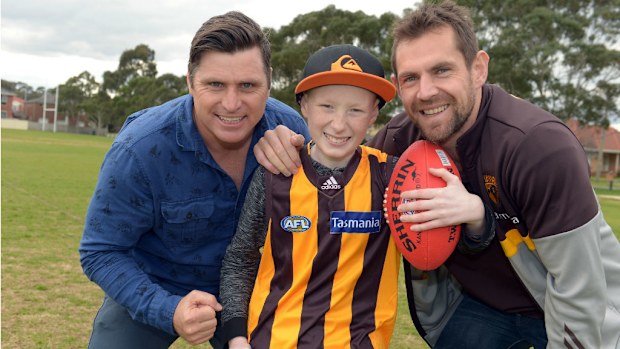 AFL great Shane Crawford (left) and Hawthorn's Luke Hodge (right) with Riley Macnee. (Supplied)