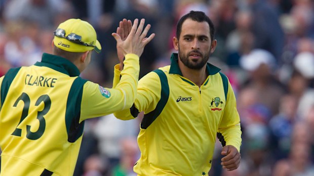 Fawad Ahmed celebrates with captain Michael Clarke after taking the wicket of England's Jos Buttler for 75 as his team win by 88 runs during a One Day International in England in 2013. (AAP)