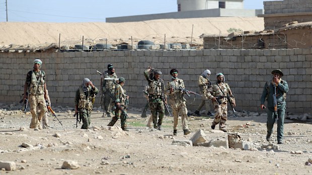 Shiite fighters from the Hashed al-Shaabi (Popular Mobilisation) enter the village of Ayn Nasir, south of Mosul, on October 29, 2016. (AFP)