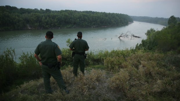 Border Patrol agents monitor the Rio Grande watching for illegal immigrants crossing into the US. (Photo by John Moore/Getty Images)