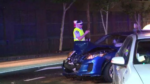 A woman is under police guard in hospital following a three-car crash. (9NEWS)