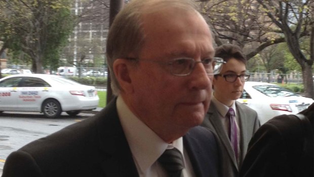 Father Stanislaus Hogan, 69, (left) leaves the District Court in Adelaide last year. (AAP)
