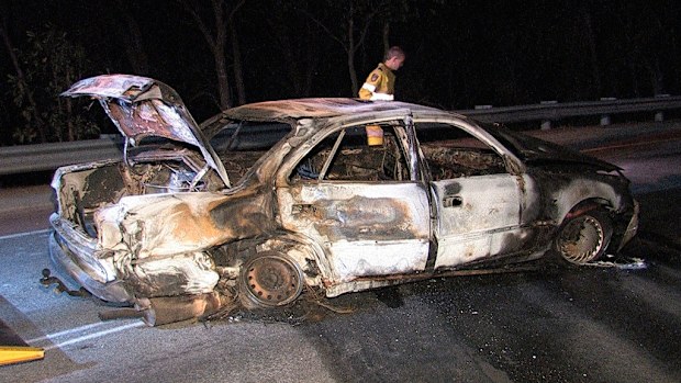 The burnt-out car after the crash. (9NEWS)