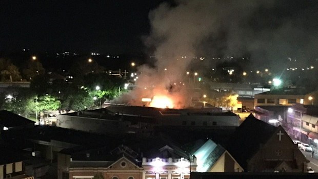 Fire engulfs the floor above a Middle Eastern restaurant in Fairfield. (Twitter, @gordonkuzet)