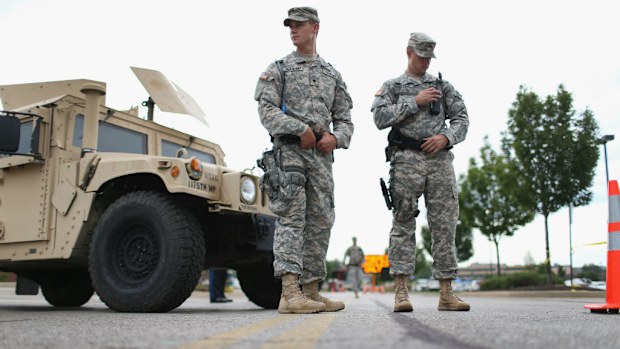 Missouri National Guard troops are deployed to provide protection for a police command center in Ferguson, Missouri. (Photo by Joe Raedle/Getty Images)