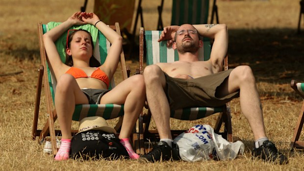 Sunbathers enjoy the hot weather in London's Hyde Park. (AAP)