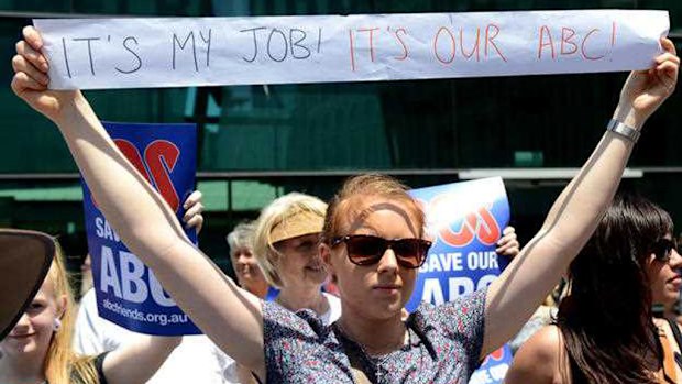 The 400 likely redundancies represent almost 10 percent of the ABC workforce. A worker protests against cuts at Federation Square in Melbourne. (AAP)