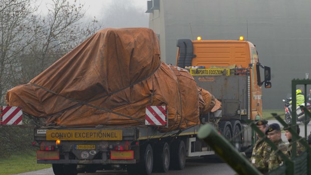 A convoy carrying pieces of wreckage from flight MH17 arrives in The Netherlands. (AAP)