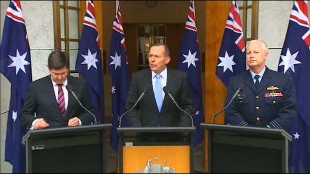 Defence Minister Kevin Andrews, Prime Minister Tony Abbott and Chief of the Defence Force Mark Binskin make the announcement in Canberra. (9NEWS)