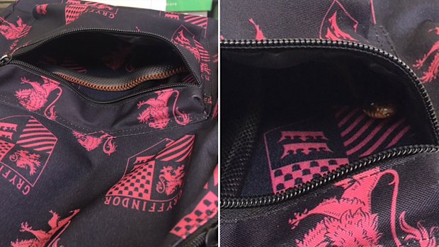 A red-bellied black snake liked the look of this Queensland schoolgirl's backpack. (Image: Snake Catchers Brisbane via AAP)
