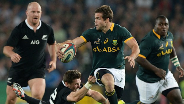 Cobus Reich of the Springboks breaks away from the All Blacks defence. (Getty)