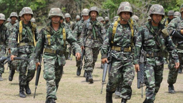 Thai soldiers carry their weapons as they take part in the Cobra Gold military exercises at a military base in Lopburi province. (PORNCHAI KITTIWONGSAKUL/AFP/Getty Images)