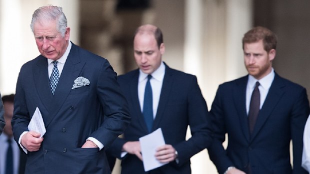 Charles and William walking with Prince Harry.
