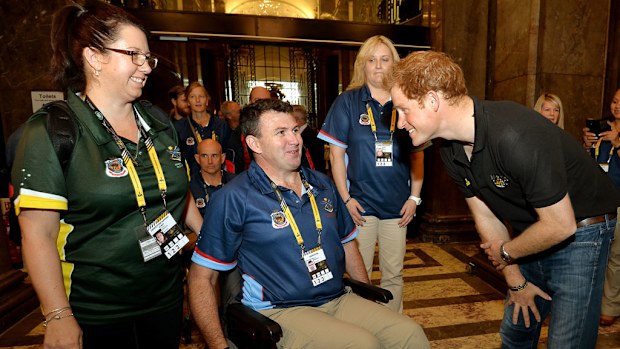 Prince Harry meets Garry Robinson and his wife Katrinaas. (Getty Images)