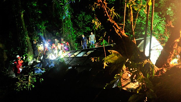 Rescue crews work through the night at the crash site in Brazil. (AAP)