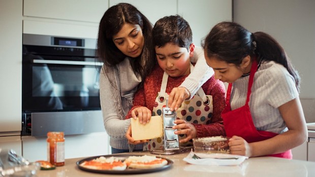 Mother and disabled child cooking