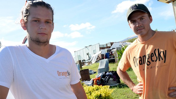 Orange Sky Laundry co-founders Lucas Patchett (L) and Nic Marchesi in Yeppoon after Cyclone Marcia. (AAP)