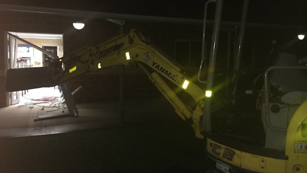 Vandals have used an excavator to smash through the wall of Riverton Primary School. (Twitter)