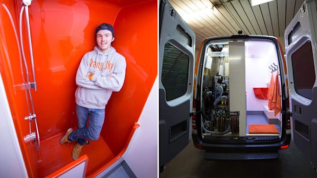 One of Orange Sky Laundry's founders Nic Marchesi poses with the new shower van. (Orange Sky)