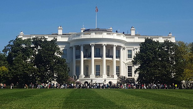 A man traipsed around the White House grounds for more than 15 minutes before he was spotted and caught. (AAP)