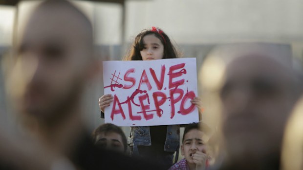 A Syrian girl holds a placard during demonstrations in Tripoli, Lebanon earlier this month. (Ibrahim Chalhoub /AFP)