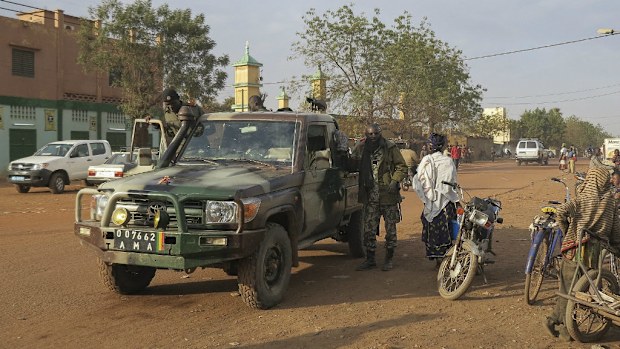 A file photo shows Malian forces patrolling through the northern town of Sevare where the hotel siege occured. (AAP)