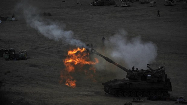 An Israeli tank fires a shell during the latest round of violence. (Getty)