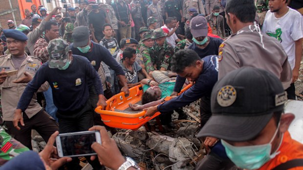 Officials have appealed for more medicine and doctors in the wake of a devastating earthquake in Aceh, Indonesia. (AFP)