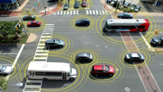General Motors sees a driving future where cars communicate with each other, to reduce driver error. (GM)