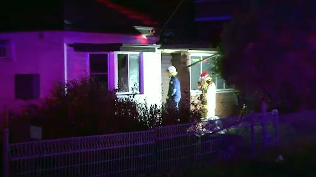 A woman is hospital after being rescued from a house fire by her boyfriend. 