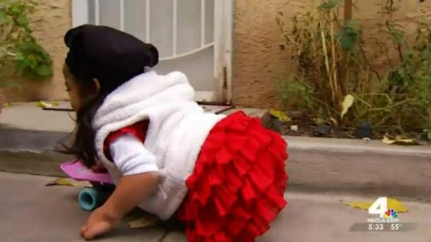 Milagros, 'Miracle' in Spanish, was born without legs and has been using a skateboard to move around since her wheelchair was stolen. (NBC)