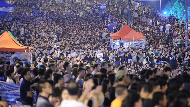 Tens of thousands of pro-democracy protesters gather close to Hong Kong government headquarters. (AAP)