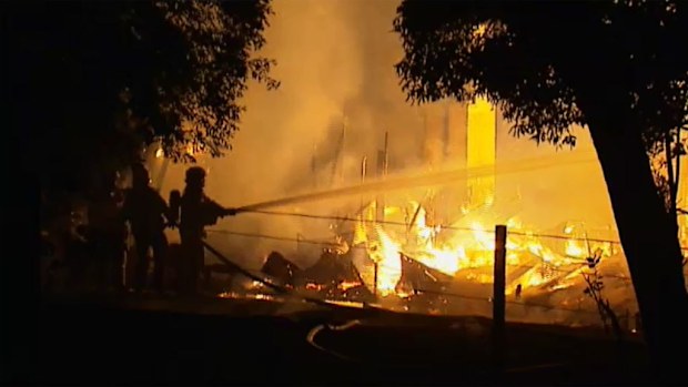 Firefighters battle to extinguish the Vermont house fire. (9NEWS)