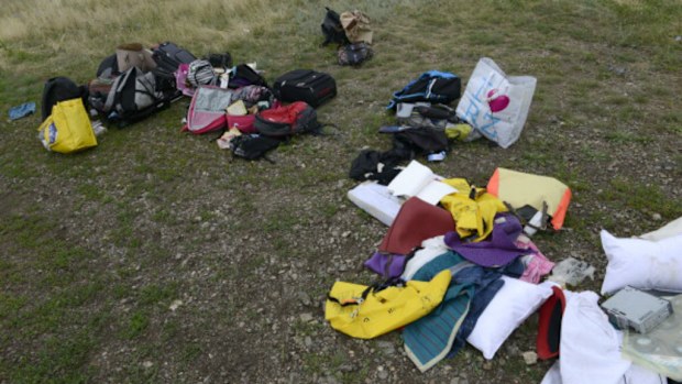 There are reports that Russian rebels are looting the crash site and have removed victims' bodies from the scene.