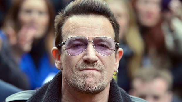 U2 frontman Bono arrives at a London studio to record the Band Aid 30 single to help fight Ebola. (AAP)