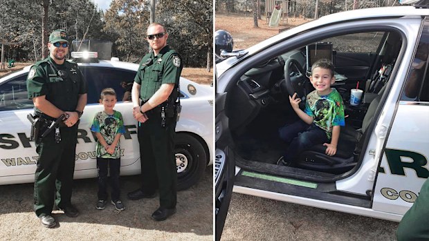 Billy stands alongside two officers from the Walton County Sheriff's Office. (Facebook/WCSO)